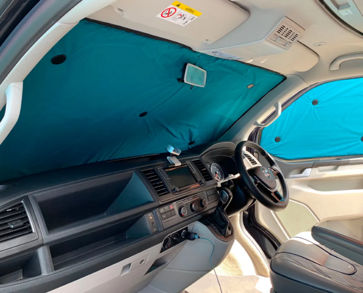 Windscreen and side window blinds fitted in a van cab