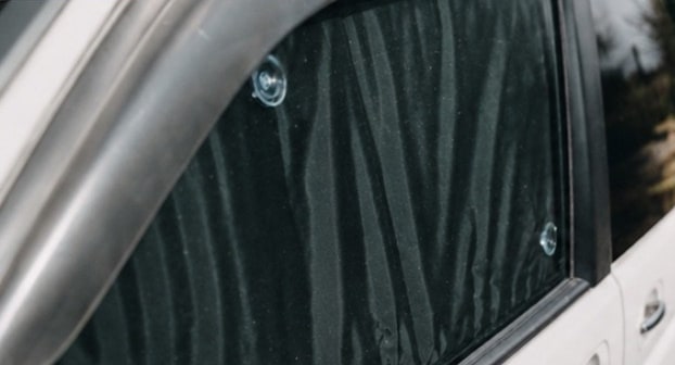 Van window from outside with a Stealth blind fitted: it looks like dark tinted glass